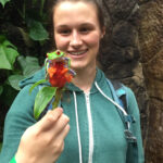 gifted science teen admiring tree frog